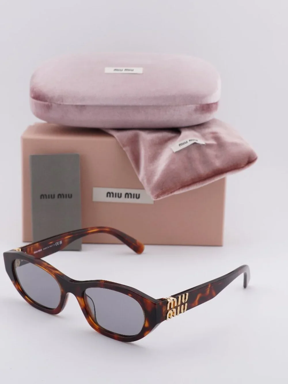 Miu Miu MUA03S 21C40O Oval Sunglasses – Havana Mahogany\ Grey